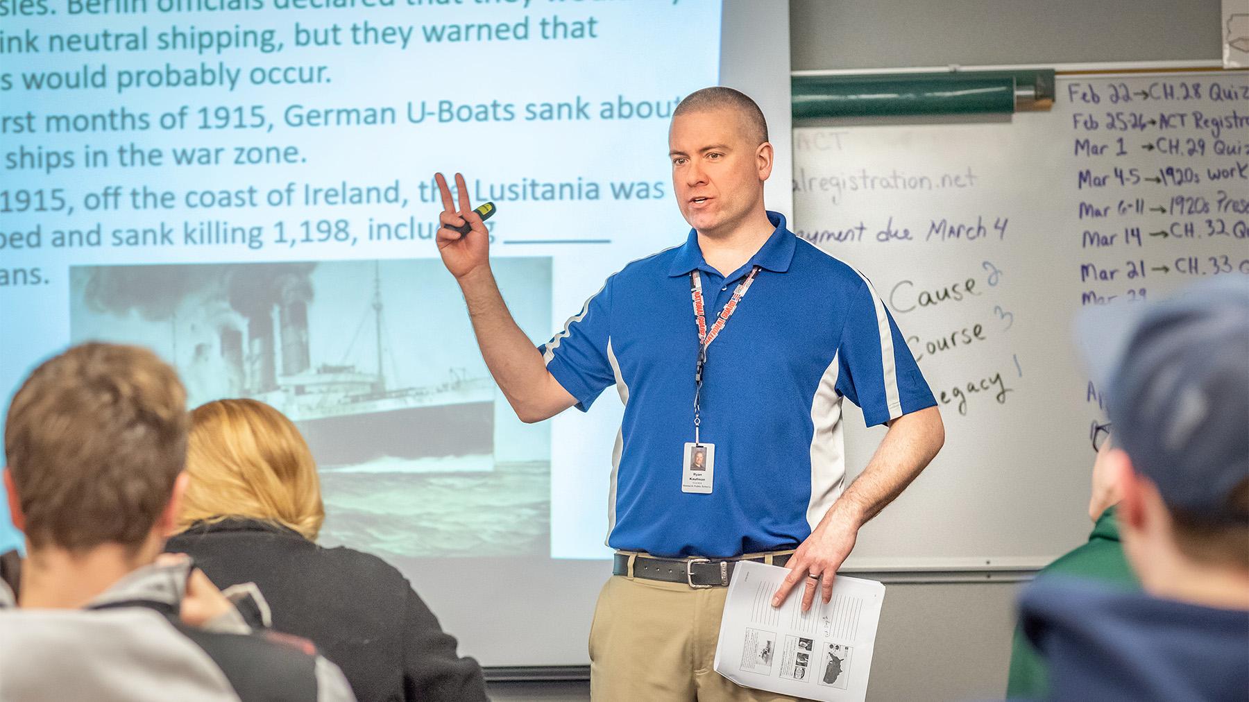 Teach and students in a class discussion