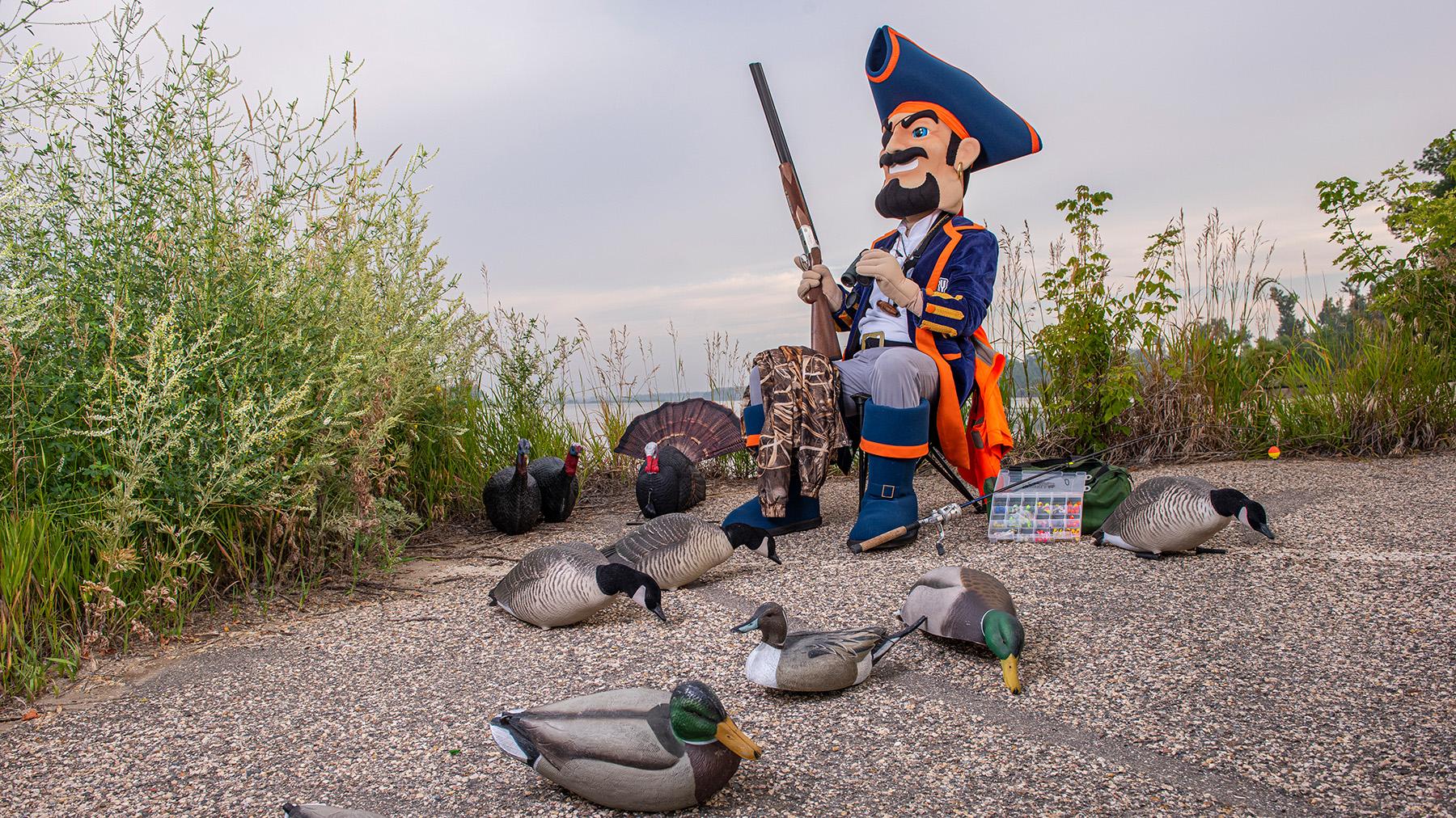 Max with decoy birds and a shot gun