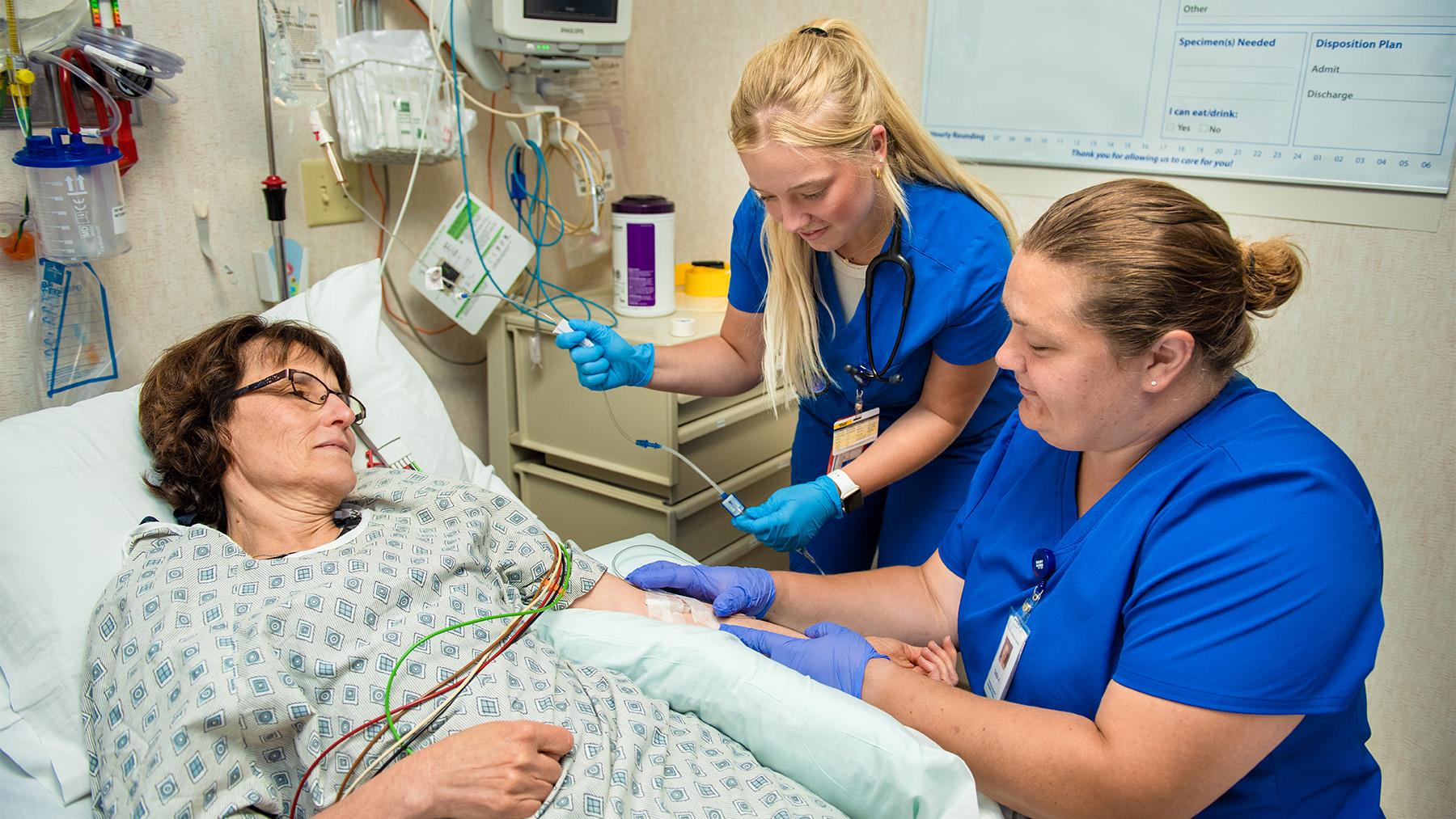 students working with a patient in Saint Alexis Hospital