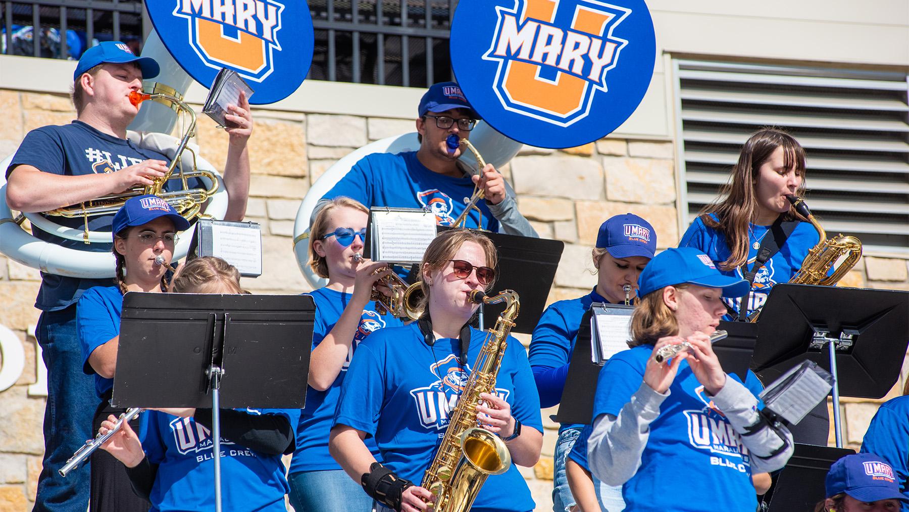 Pep band students at a football game