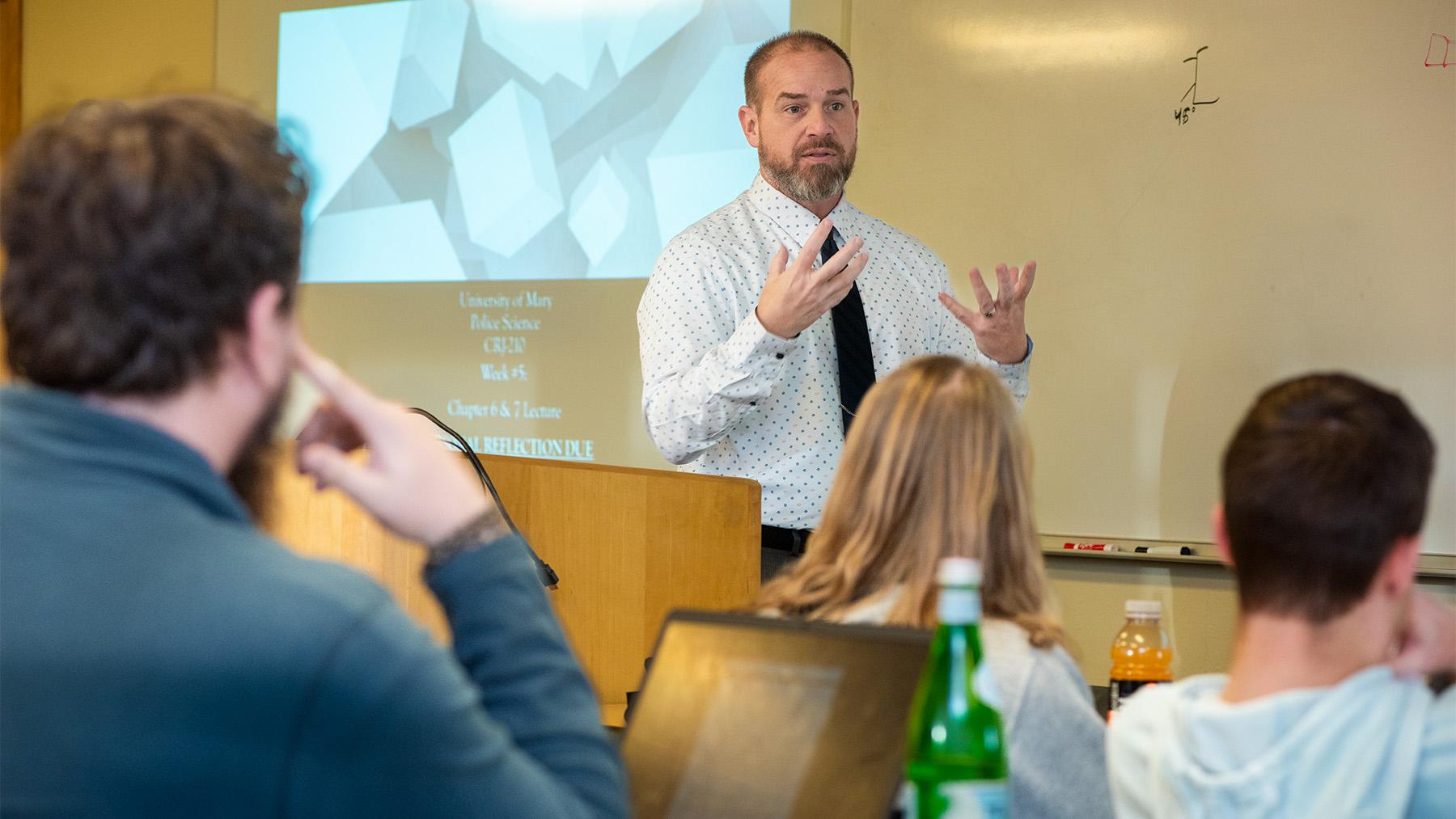 Crimial Justice professor teaching a class.