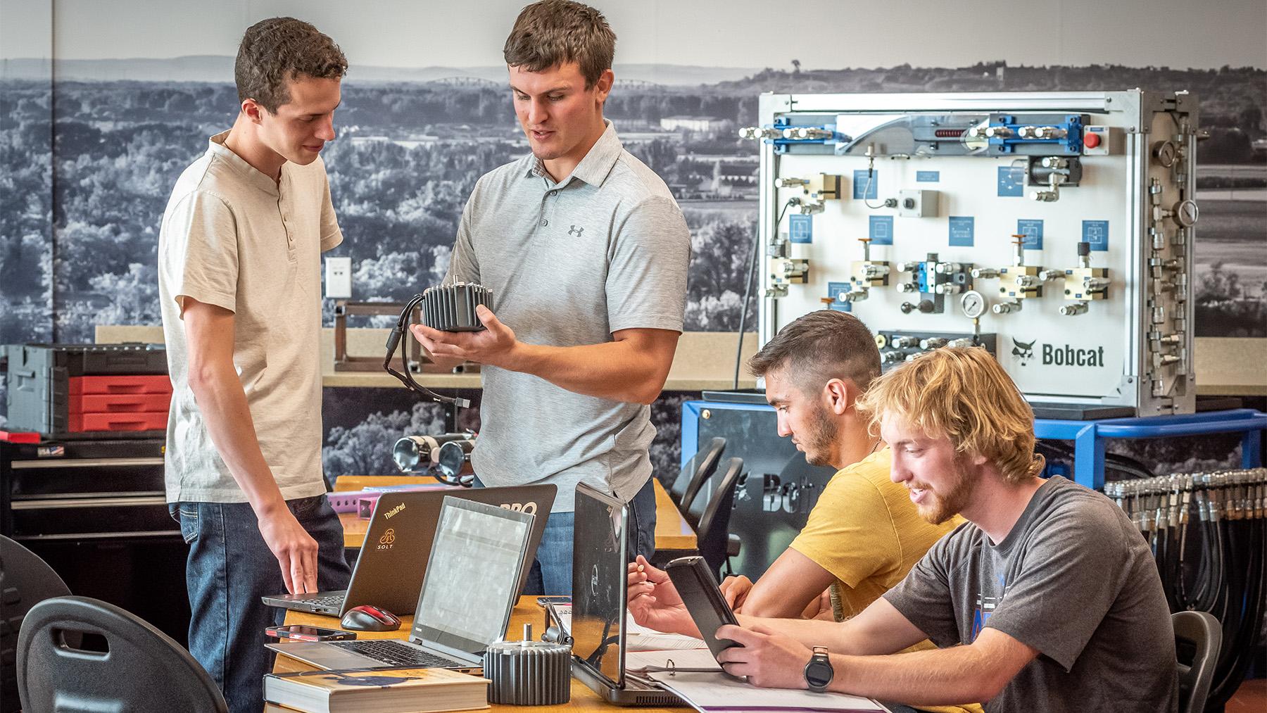 Students working on a project in the engineering classroom.