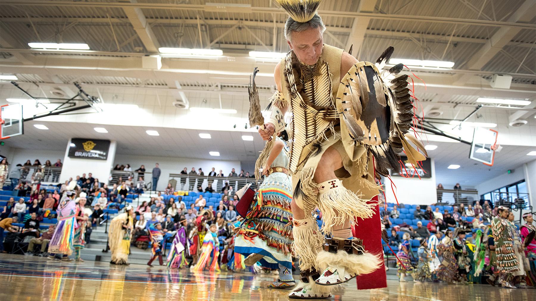 A native American doing a traditional dance