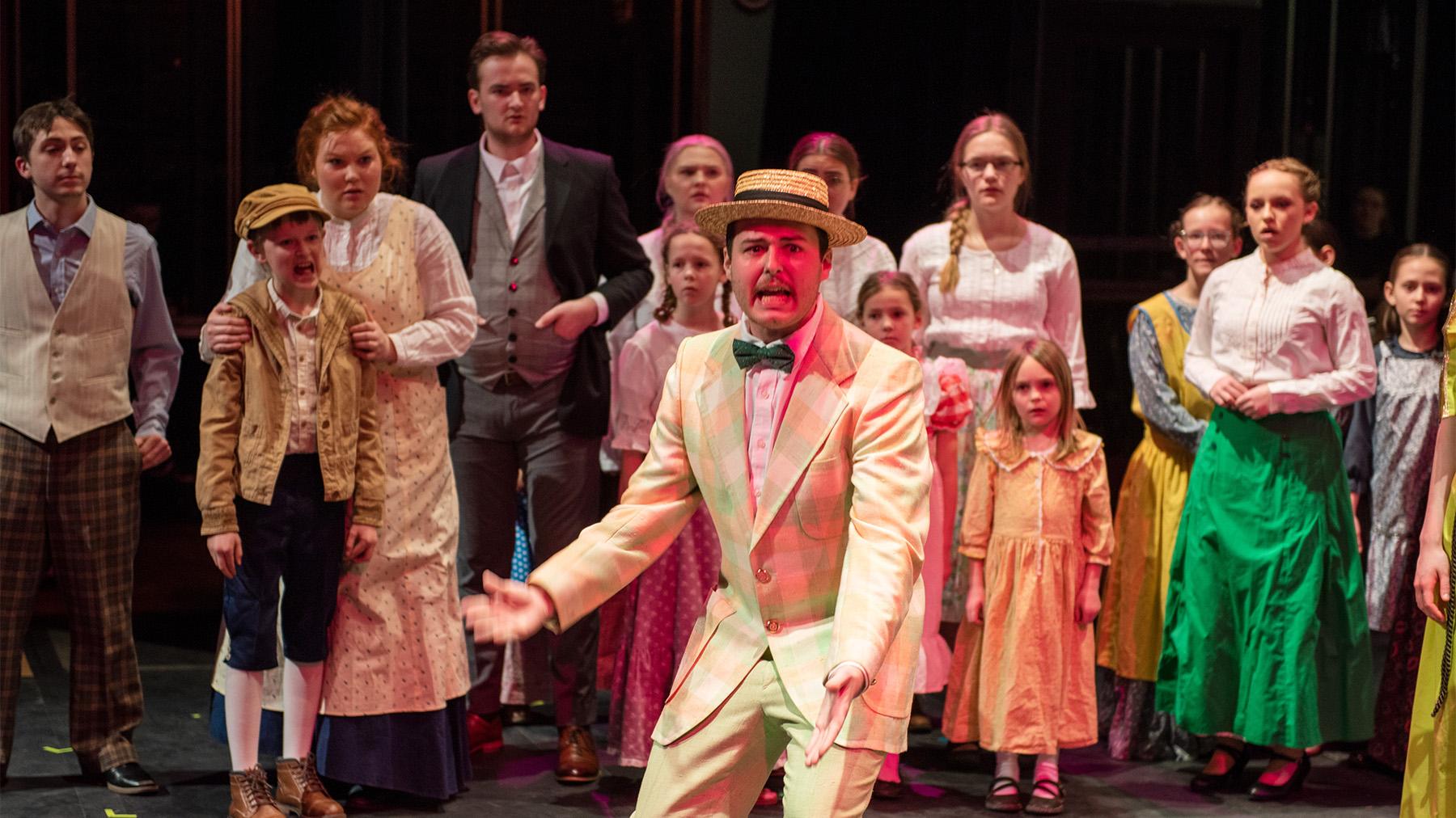 Students performing in the musical Music Man.