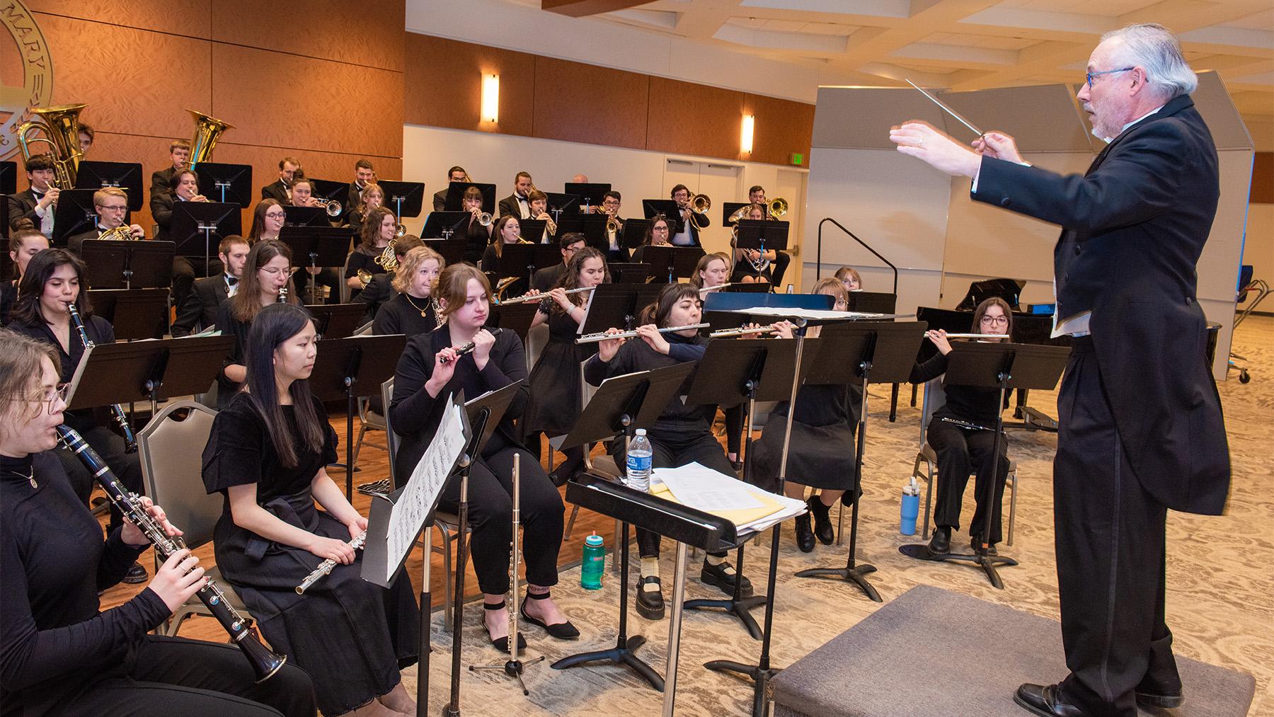 Denis Gowen conducting students in the Spring Concert.