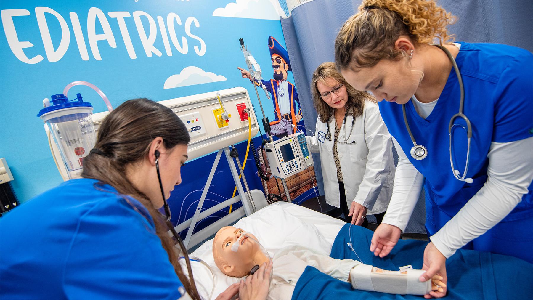 Nursing students working in the simulation labs.