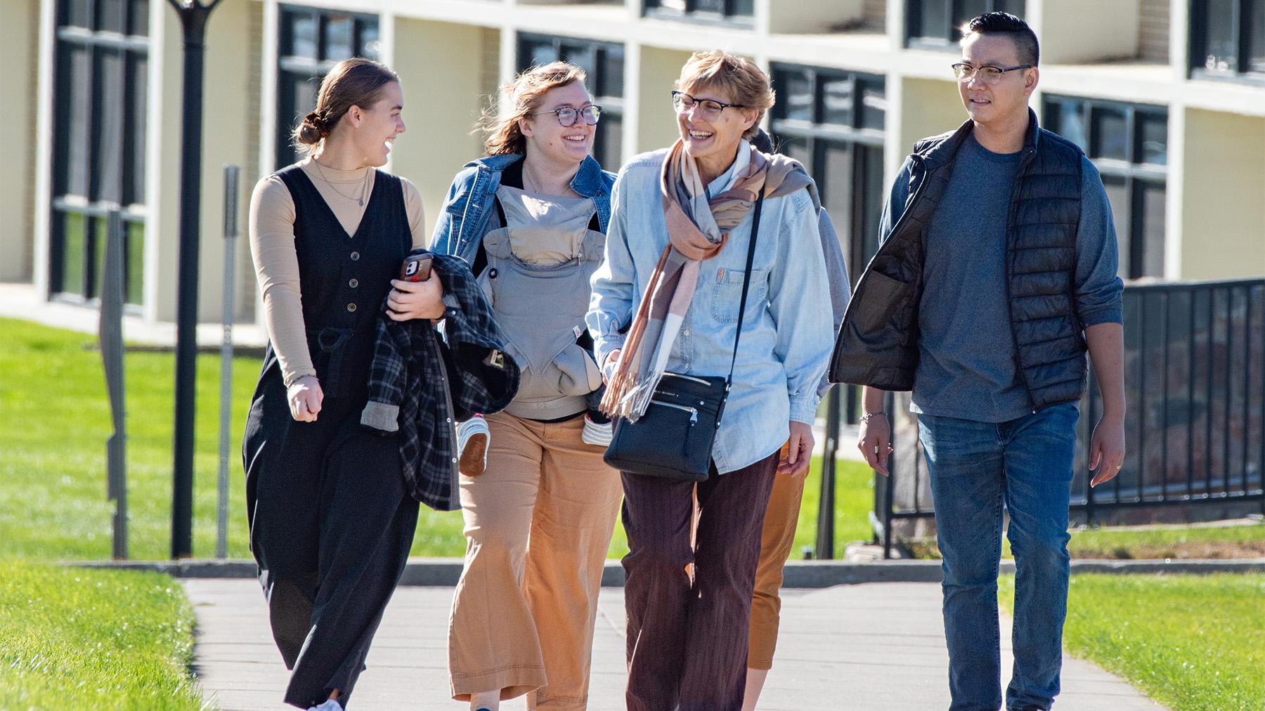 Parents getting a tour of the university of mary campus.