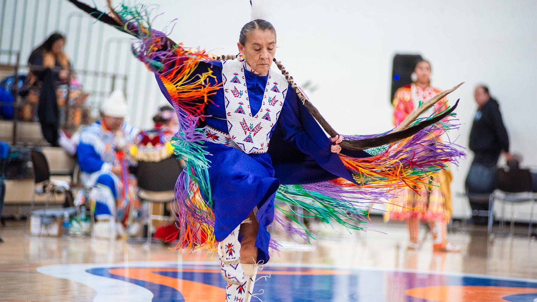 A native American doing a traditional dance.