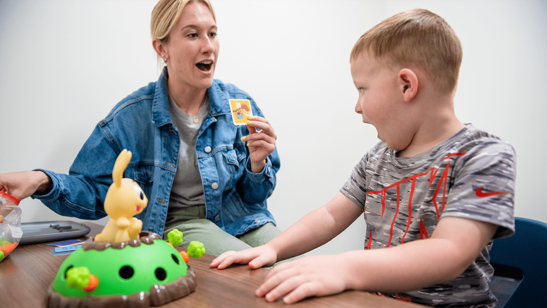 A student working with a child on speech skills