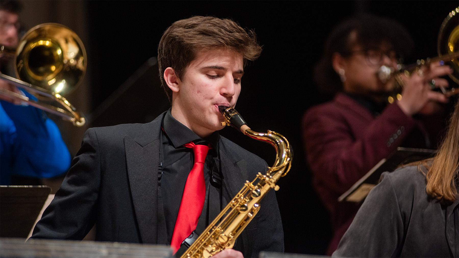 student playing the saxophone at Jazz Fest