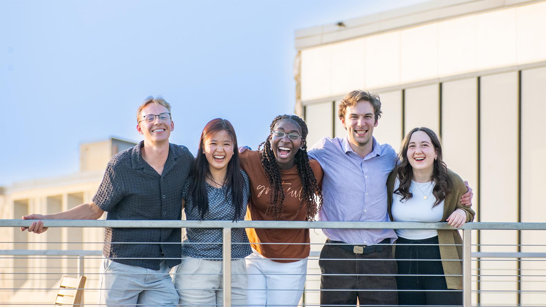 students on the balcony on campus