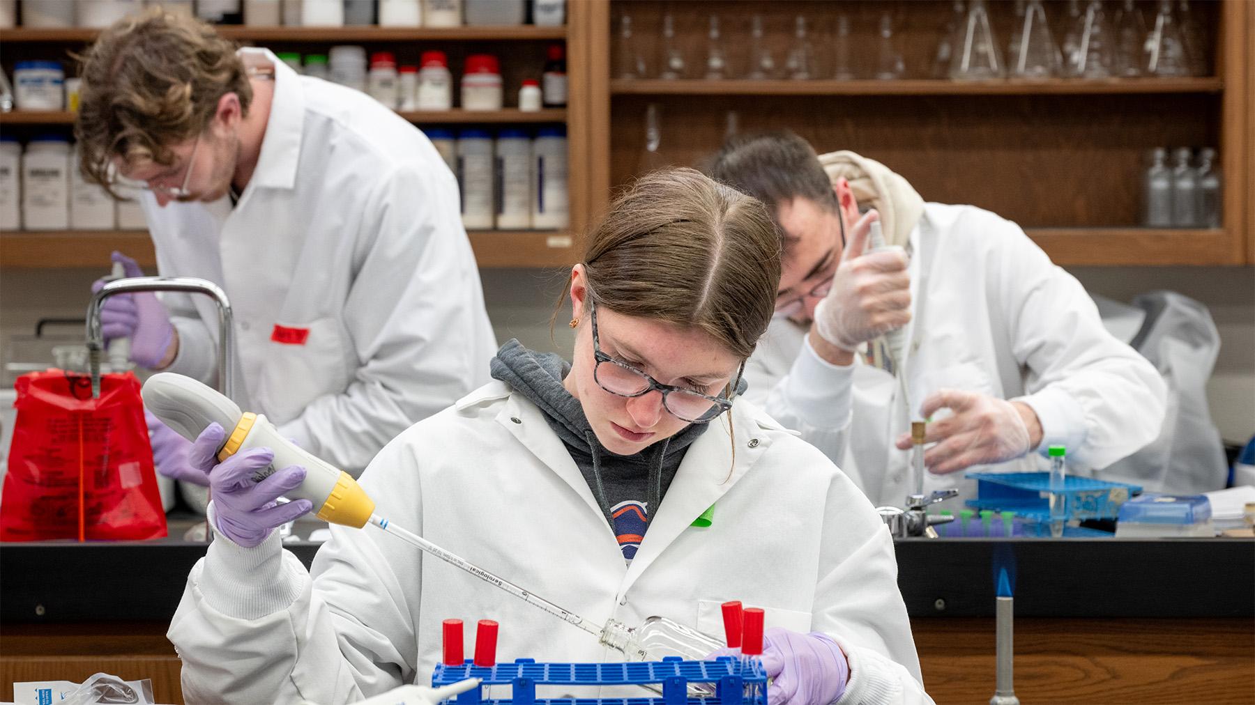 three students working on Phages research 