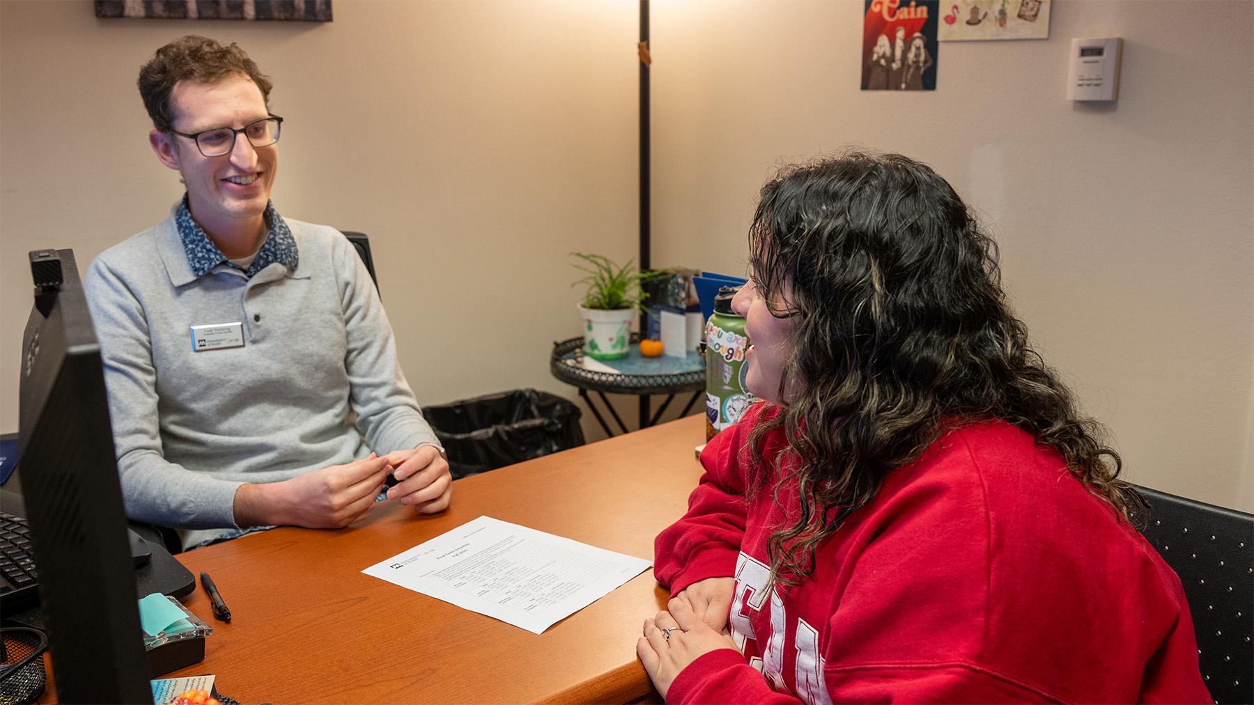 student working with an advisor in the student success center