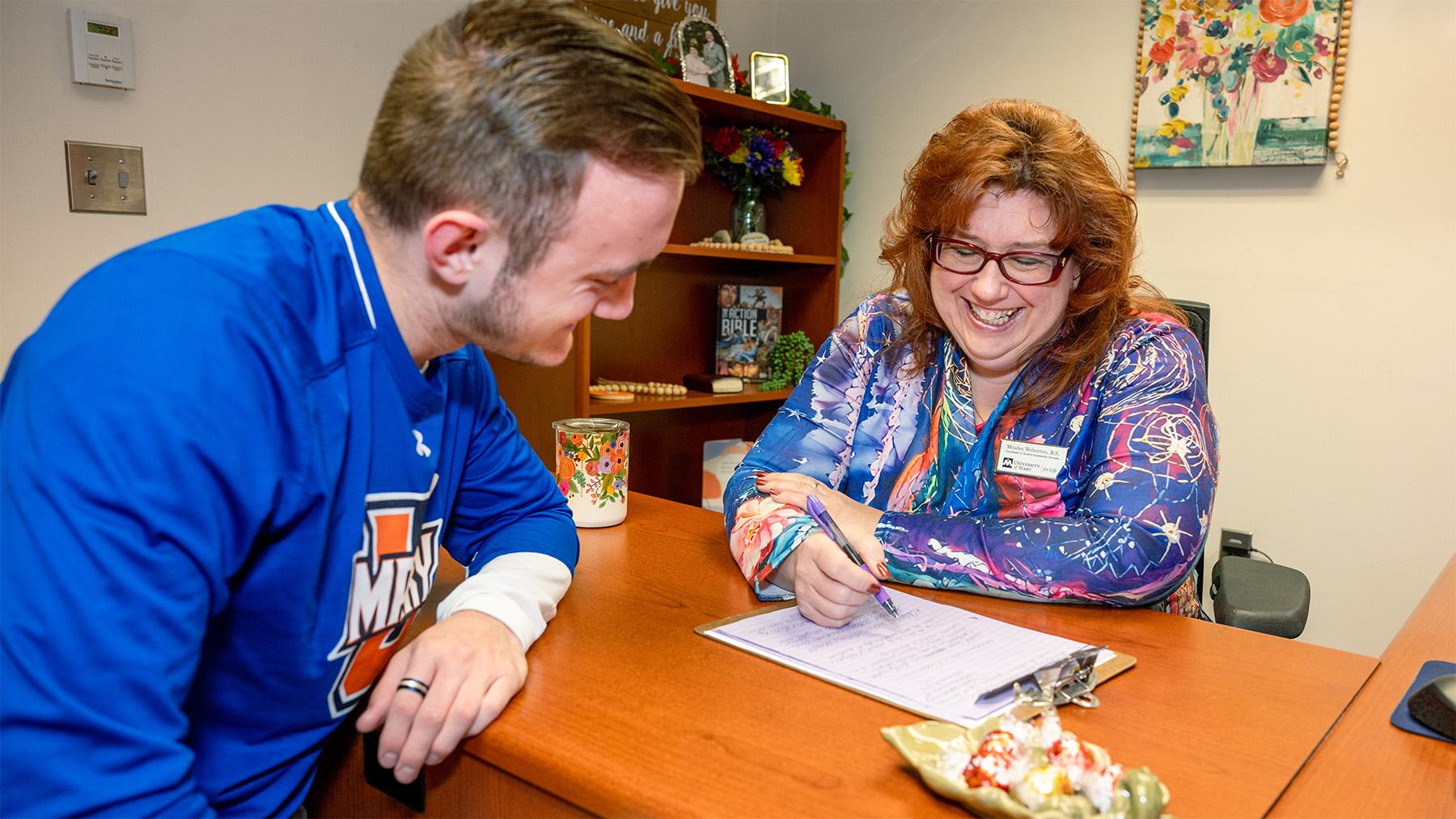 student working with an advisor