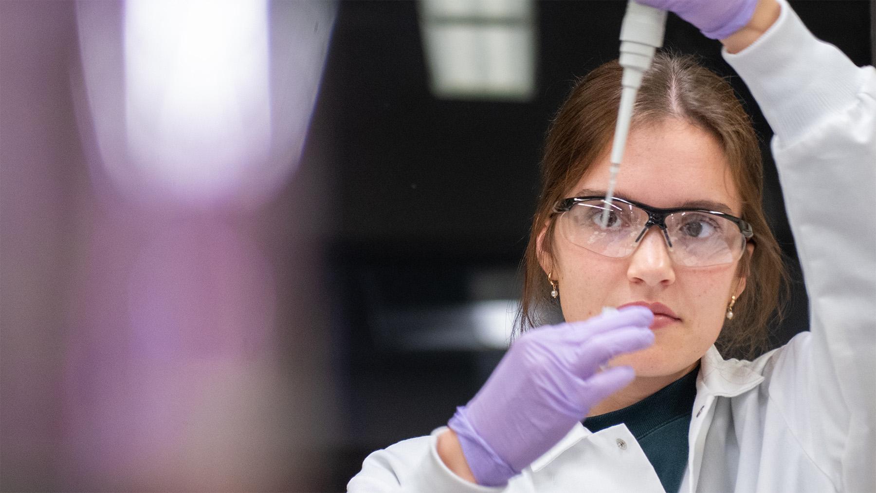 a female student doing a test for Phages Rsearch