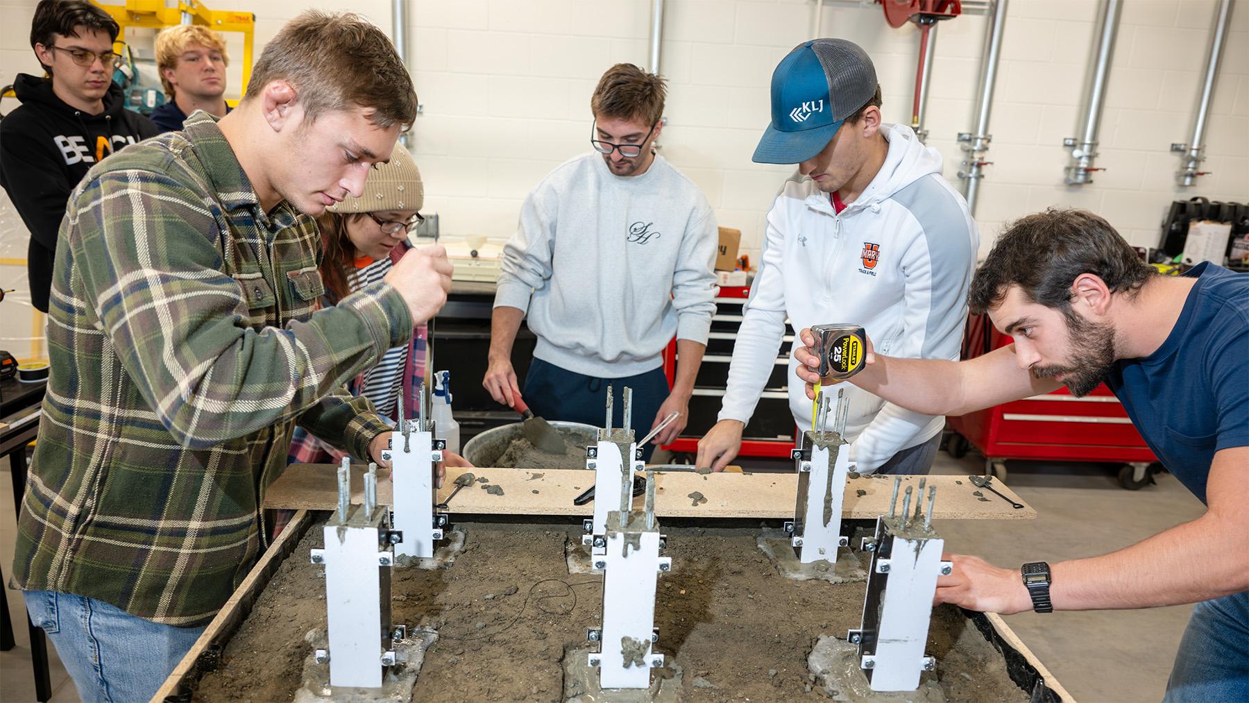 Students working on a construction project.