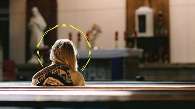Woman praying in church